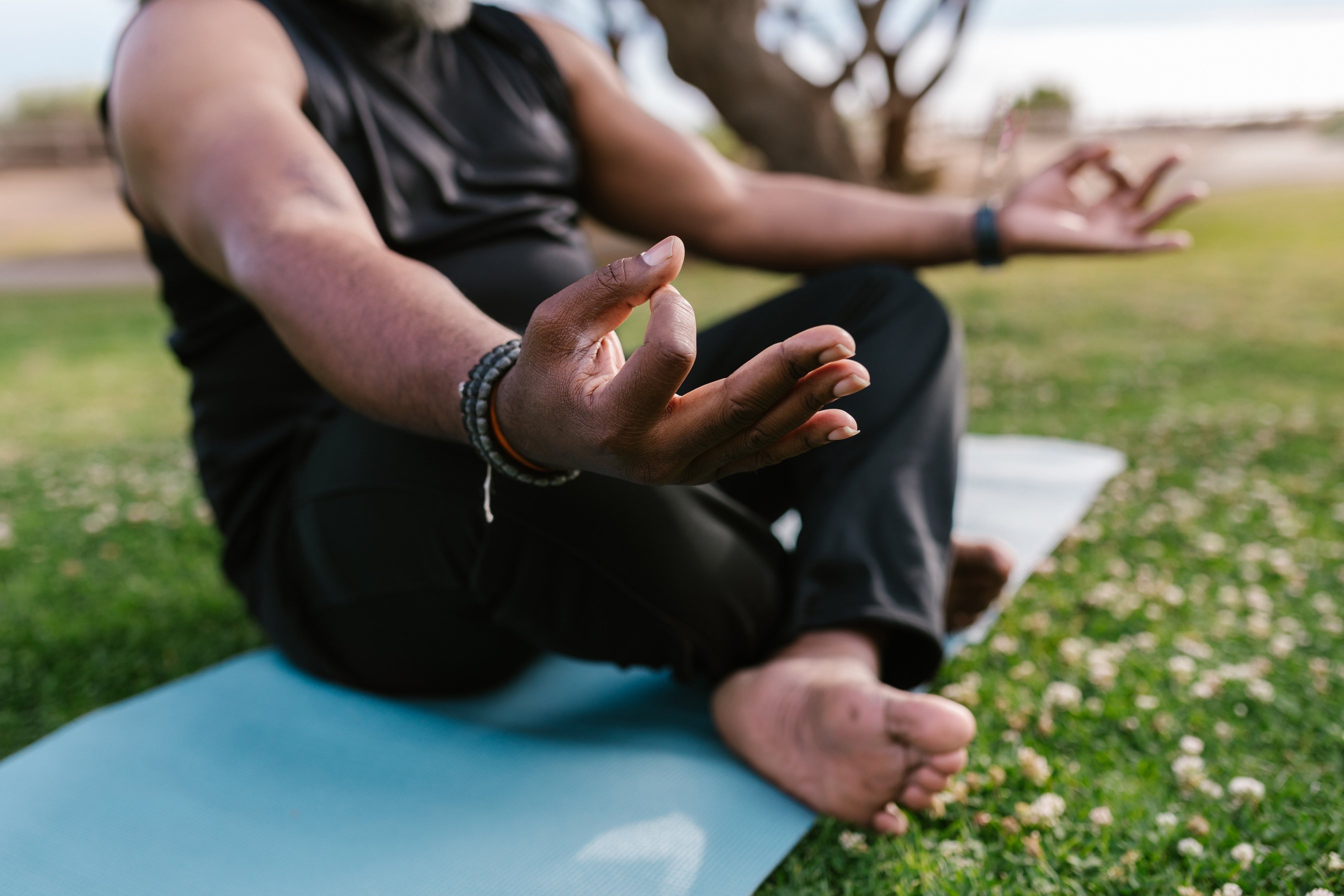 A Man Doing Yoga Sitting on Yoga Mat